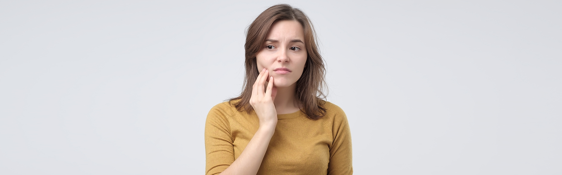 girls with jaw pain treatment available in UR Smile Dental